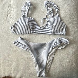 New! H&M Bikini top and bottom light blue with ruffles.